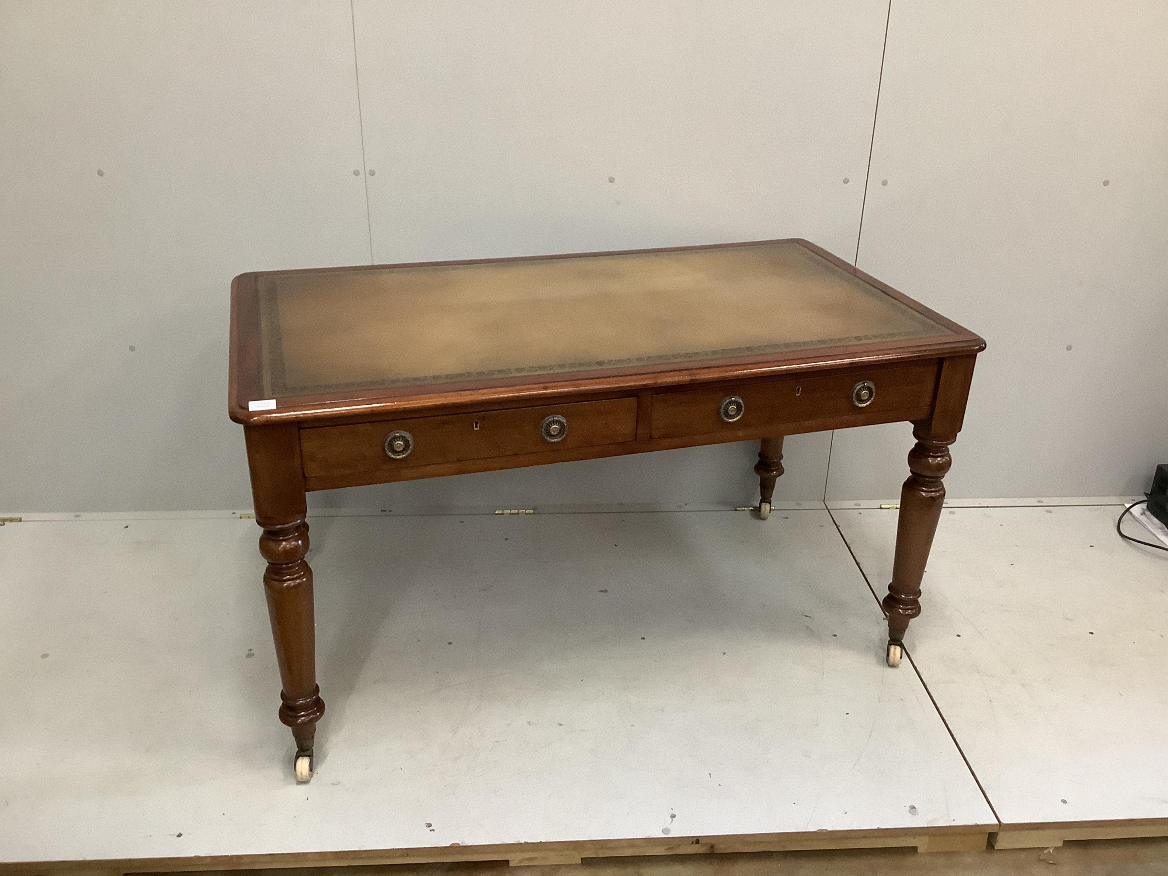 A Victorian mahogany two drawer writing table, width 136cm, depth 78cm, height 76cm. Condition - good